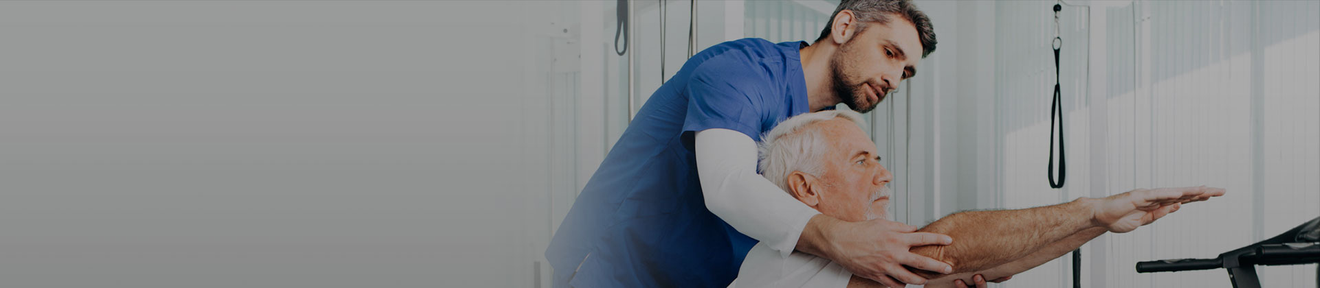 Nurse helping patient raise their arms